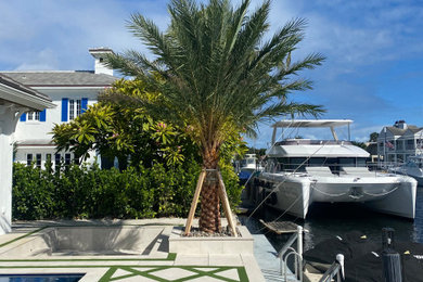 Island style home design photo in Miami