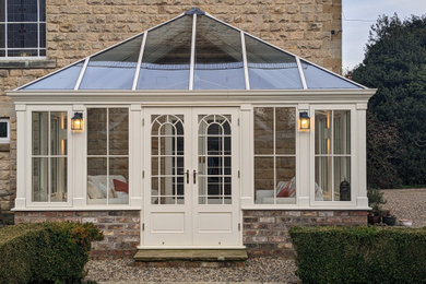 This is an example of a large traditional conservatory in Other.
