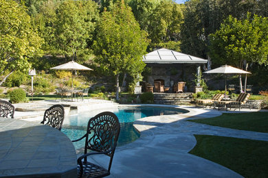 Inspiration for a rustic pool remodel in Orange County