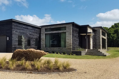 Large trendy one-story exterior home photo in Other