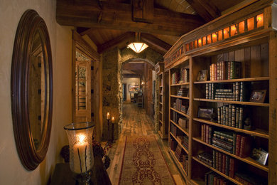 Hallway - mid-sized traditional medium tone wood floor hallway idea in Denver with beige walls