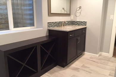 Bathroom - mid-sized transitional 3/4 black tile, blue tile, gray tile and matchstick tile porcelain tile and gray floor bathroom idea in Denver with shaker cabinets, dark wood cabinets, gray walls, granite countertops, a one-piece toilet and an undermount sink