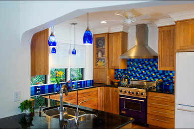 Inspiration for a mid-sized contemporary u-shaped medium tone wood floor kitchen remodel in Minneapolis with shaker cabinets, no island, an undermount sink, medium tone wood cabinets, granite countertops, multicolored backsplash and ceramic backsplash