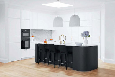 Inspiration for a large contemporary eat-in kitchen in Sydney with a double-bowl sink, shaker cabinets, white cabinets, granite benchtops, grey splashback, ceramic splashback, black appliances and white benchtop.