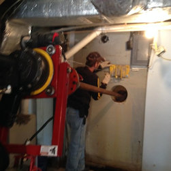 Helical tie-back install in basement wall using HAL - Products