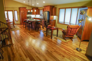 Small arts and crafts formal and open concept light wood floor and brown floor living room photo in Other with yellow walls, no fireplace and no tv