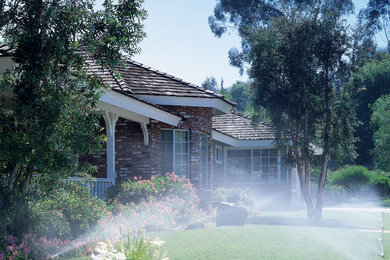 Inspiration for a mid-sized traditional full sun front yard concrete paver landscaping in Toronto.