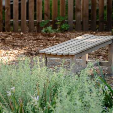 Creekside Restoration: Serene Bench on Decomposed Granite Patio