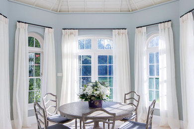 Nautical dining room in Channel Islands with blue walls.