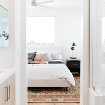 Kilim Rug and Black Nightstands with Upholstered Bed