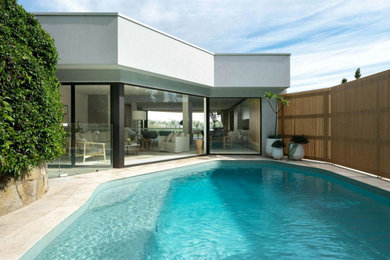 Inspiration for a contemporary backyard pool in Sydney with with a pool.