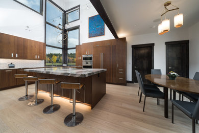 Open concept kitchen - mid-sized contemporary light wood floor and beige floor open concept kitchen idea in Denver with a single-bowl sink, flat-panel cabinets, medium tone wood cabinets, quartzite countertops, white backsplash, marble backsplash, paneled appliances and an island
