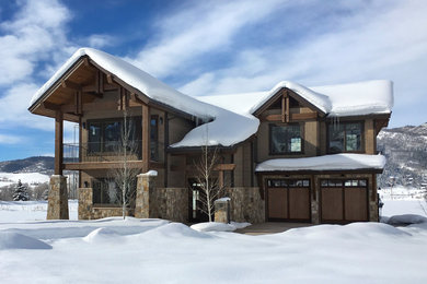 Example of a large transitional beige two-story mixed siding exterior home design in Denver