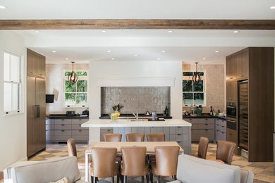 Example of a large trendy l-shaped terra-cotta tile eat-in kitchen design in New York with flat-panel cabinets, gray cabinets, stainless steel appliances, no island, solid surface countertops, gray backsplash and glass tile backsplash