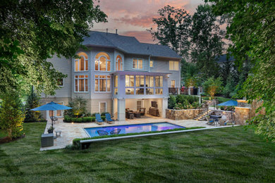 Inspiration for a timeless backyard stone patio remodel in DC Metro