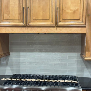 Classic Wood Kitchen with Modern Glass Backsplash