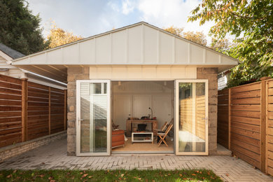Inspiration for a small contemporary freestanding desk beige floor home studio remodel in New York with white walls