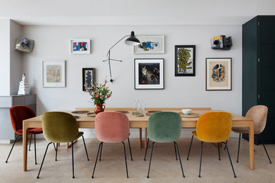 Inspiration for a large bohemian open plan dining room in London with grey walls, ceramic flooring and beige floors.