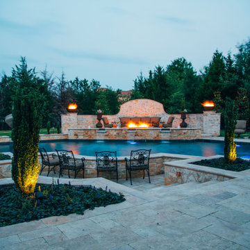 Straight line pool and spa with slide and outdoor kitchen