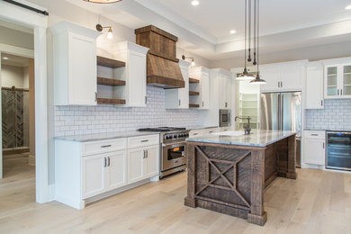 Example of a farmhouse kitchen design in Charlotte