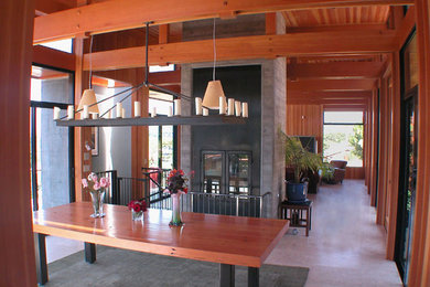 Inspiration for a large modern porcelain tile and beige floor enclosed dining room remodel in San Francisco with brown walls and no fireplace