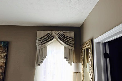 Inspiration for a mid-sized timeless formal and enclosed carpeted living room remodel in Cleveland with brown walls, no fireplace and no tv
