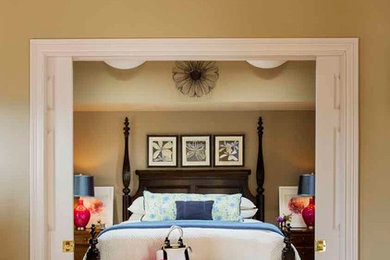 Elegant light wood floor bedroom photo in Providence with beige walls