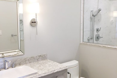 Inspiration for a mid-sized contemporary 3/4 wet room bathroom in Other with shaker cabinets, grey cabinets, a one-piece toilet, white tile, ceramic tile, grey walls, porcelain floors, a drop-in sink, engineered quartz benchtops, white floor, a hinged shower door and multi-coloured benchtops.