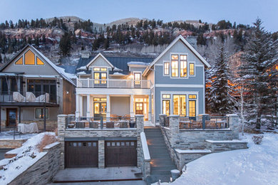 Inspiration for a large rustic multicolored two-story mixed siding exterior home remodel in Denver with a metal roof