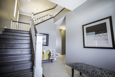 Mid-sized trendy vinyl floor foyer photo in Other with gray walls