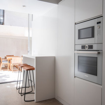 Kitchen with Integrated Ovens in Picoas Apartment