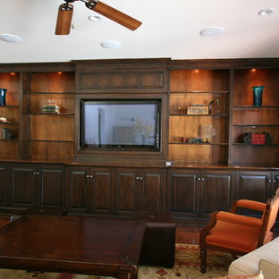 Photo of a large classic open plan home cinema in Los Angeles with beige walls, marble flooring and a built-in media unit.