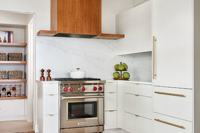 Example of a large trendy u-shaped medium tone wood floor and brown floor kitchen pantry design in Portland with an undermount sink, flat-panel cabinets, white cabinets, quartz countertops, white backsplash, stone slab backsplash, paneled appliances, no island and white countertops