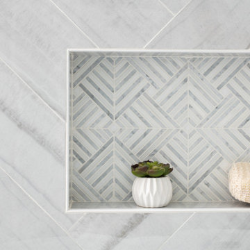 Marble Shampoo Niche Accent Surrounded with Herringbone Porcelain Tile