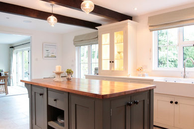 Photo of a mid-sized kitchen in Surrey.