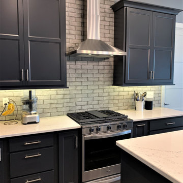 Dark Charcoal Blue Painted Kitchen With Bar Height Island