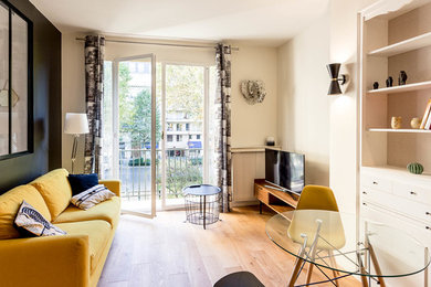 This is an example of a mid-sized contemporary open concept living room in Paris.