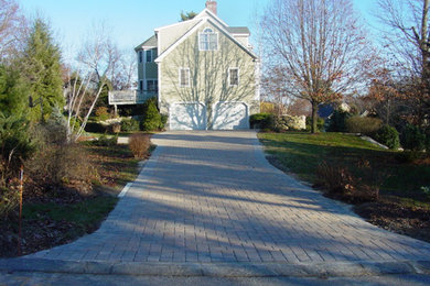 This is an example of a front yard brick driveway in Boston.