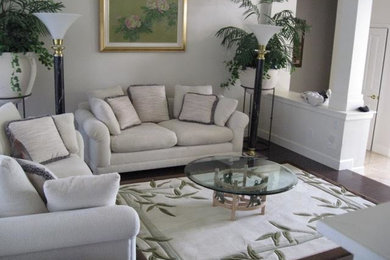 Example of a mid-sized classic open concept dark wood floor living room design in San Francisco with white walls and no fireplace