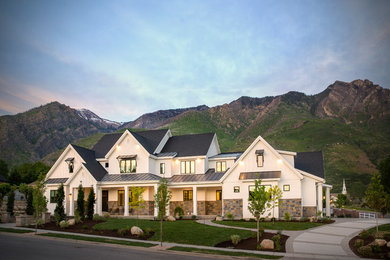 Cottage white three-story concrete fiberboard exterior home idea in Salt Lake City
