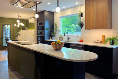 Inspiration for a mid-sized contemporary galley ceramic tile and black floor enclosed kitchen remodel in Ottawa with an undermount sink, flat-panel cabinets, black cabinets, quartz countertops, white backsplash, ceramic backsplash, black appliances, an island and white countertops