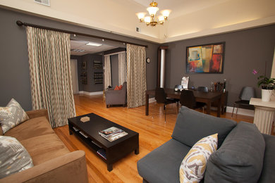 Living room - mid-sized transitional formal and open concept medium tone wood floor living room idea in Chicago with gray walls, no fireplace and no tv