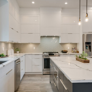 Contemporary Kitchen with Dark Faucet, Contrasting Island, and Quartz Counters
