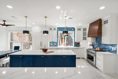 Example of a porcelain tile and white floor eat-in kitchen design in Dallas with shaker cabinets, white cabinets, quartzite countertops, blue backsplash, subway tile backsplash, stainless steel appliances, two islands and white countertops