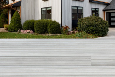 Inspiration for a modern gray metal exterior home remodel in Grand Rapids