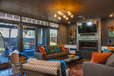 Family room - large modern open concept brown floor and dark wood floor family room idea in Phoenix with gray walls, a ribbon fireplace, a metal fireplace and a wall-mounted tv