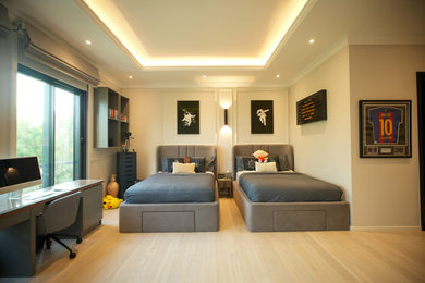 This is an example of a medium sized modern master and grey and black bedroom in London with laminate floors, beige floors, a coffered ceiling, panelled walls and a feature wall.