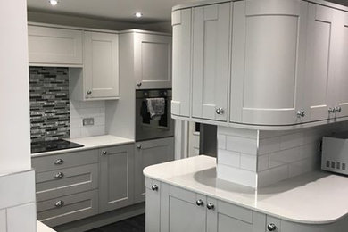 Design ideas for a contemporary kitchen in West Midlands with white worktops.