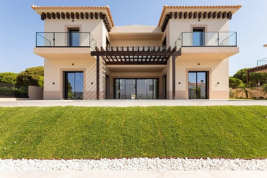 Example of an eclectic home design design in Other