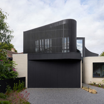 Ripple House | Metal cladding and curved brick